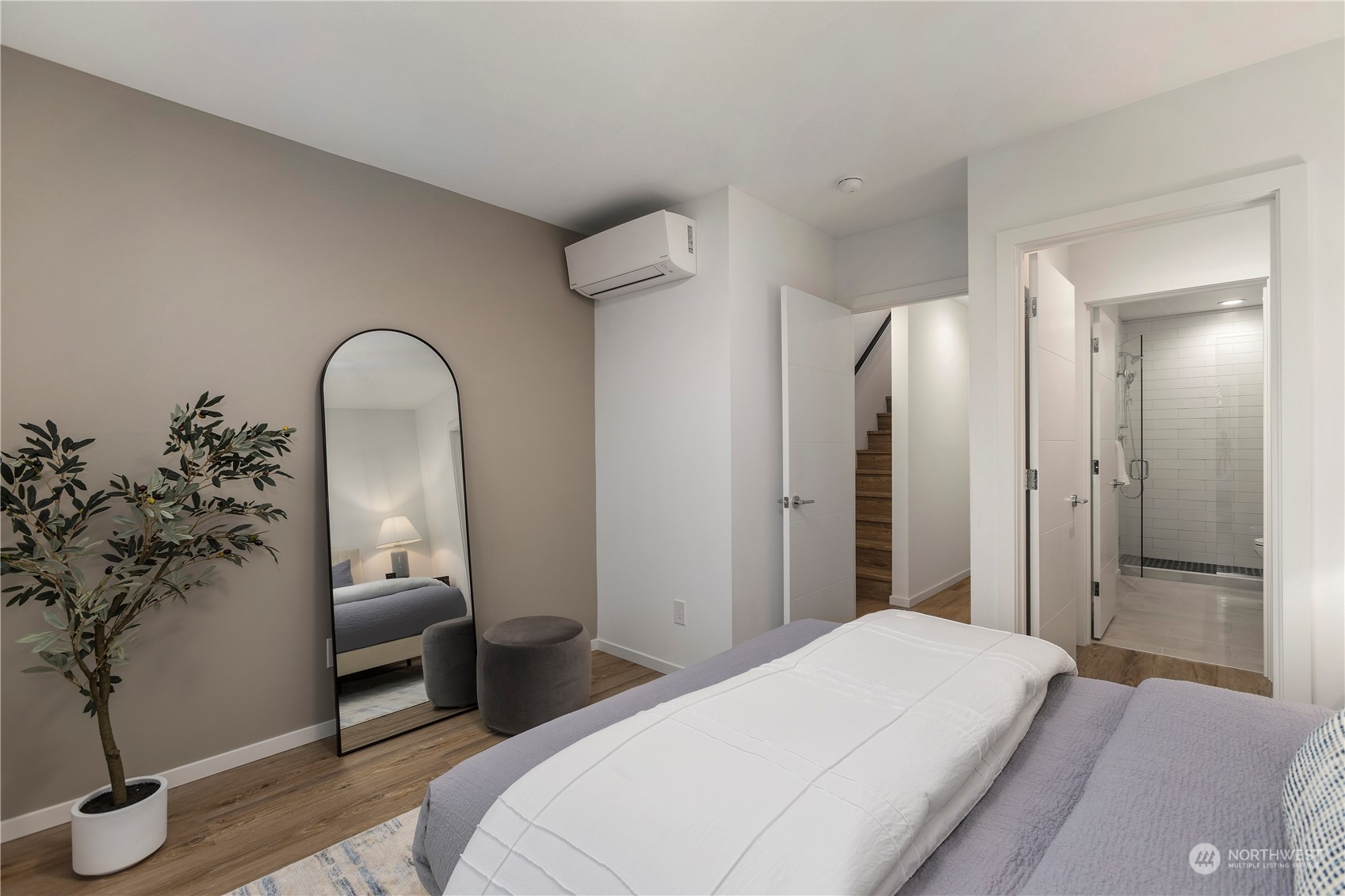 3102 South Walden Street Seattle, WA 98144 - Photo 22 of 35 a bedroom with a bed and a potted plant