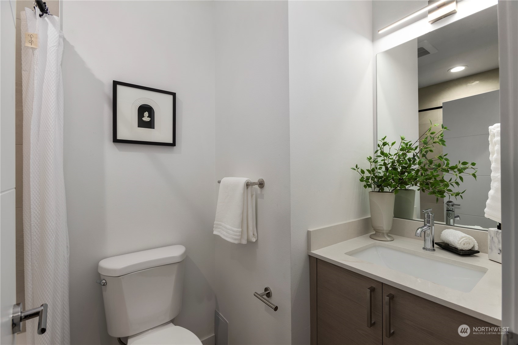 3102 South Walden Street Seattle, WA 98144 - Photo 29 of 35 a bathroom with a toilet a sink and mirror