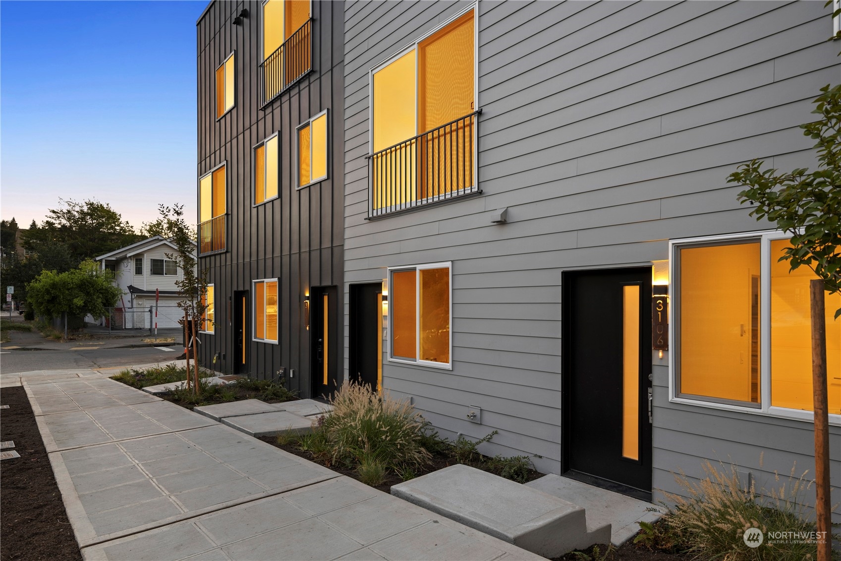 3102 South Walden Street Seattle, WA 98144 - Photo 5 of 35 a view of a brick house with many windows