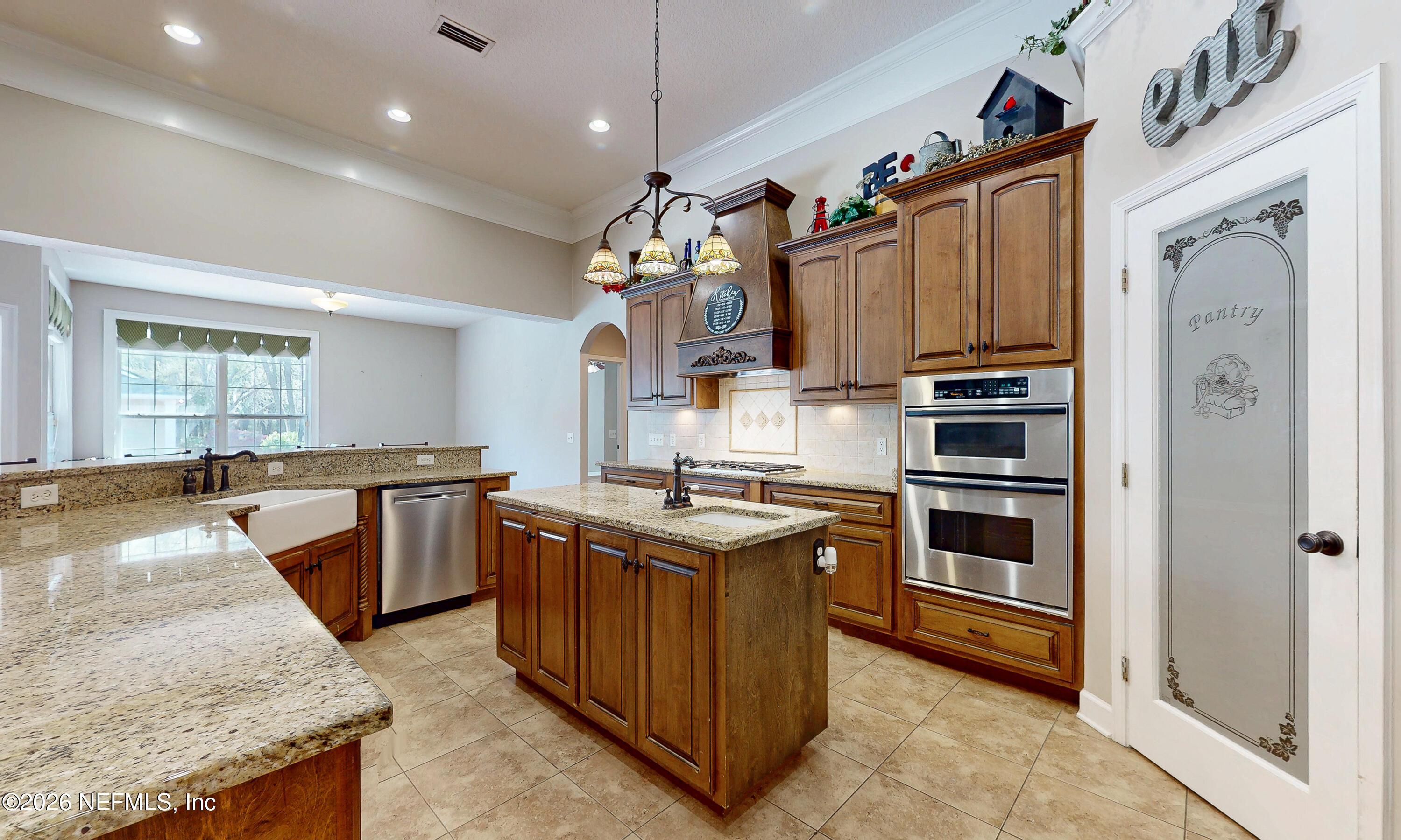 391595 Prospect Landing Hilliard, FL 32046 - Photo 15 of 69 a kitchen with granite countertop a sink stove and refrigerator