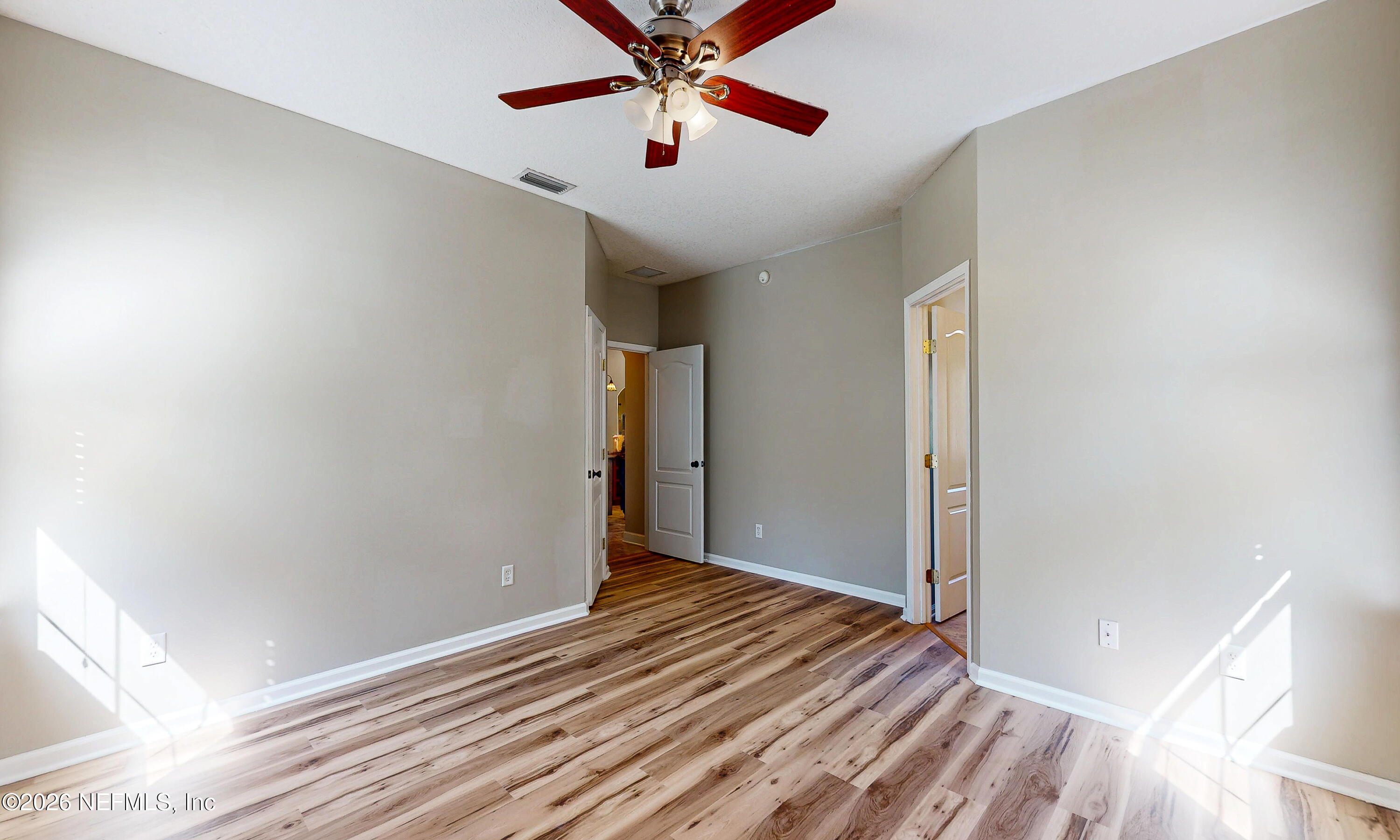 391595 Prospect Landing Hilliard, FL 32046 - Photo 29 of 69 a view of a livingroom with wooden floor and a ceiling fan