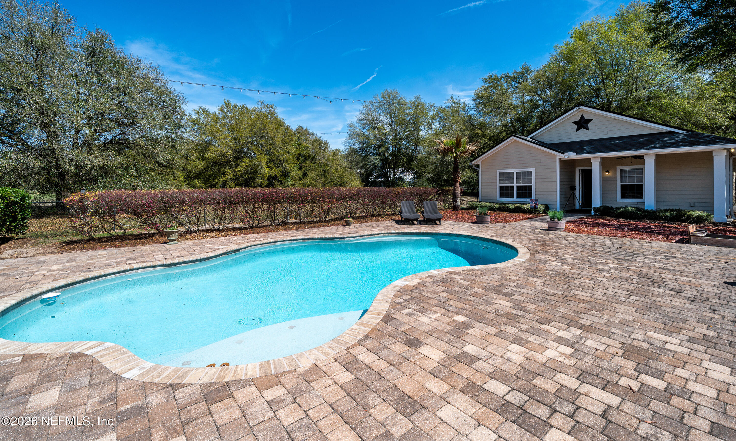 391595 Prospect Landing Hilliard, FL 32046 - Photo 43 of 69 a view of a house with swimming pool and sitting area