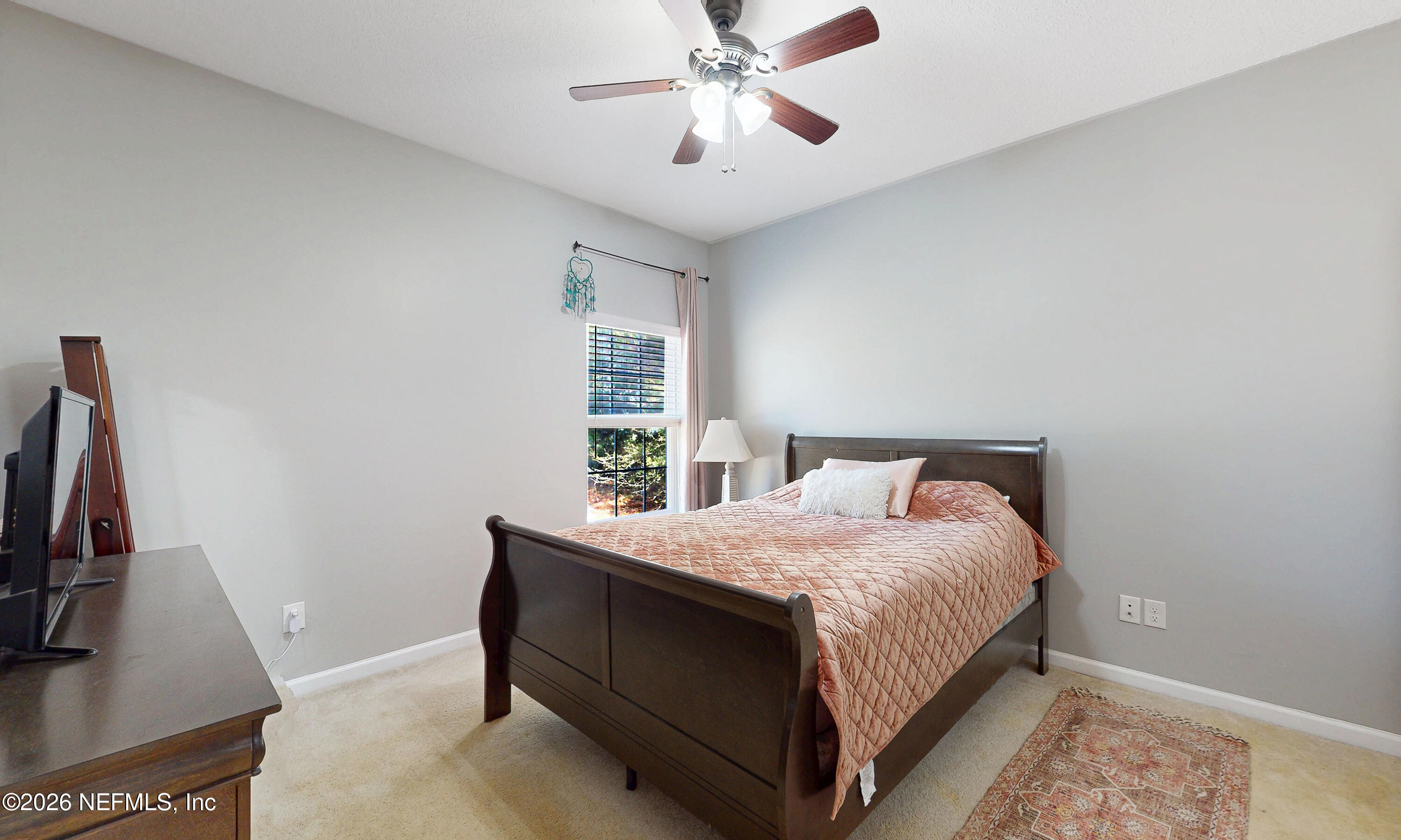 391595 Prospect Landing Hilliard, FL 32046 - Photo 56 of 69 a bedroom with a bed and a flat screen tv