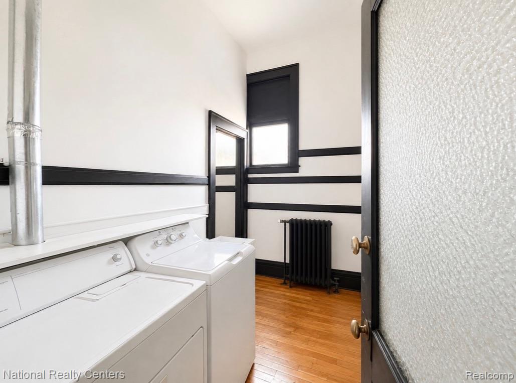 17 West Lawrence Street, Unit 2D Pontiac, MI 48342 - Photo 10 of 12 Dedicated laundry area featuring a white washer and dryer set with a built-in counter