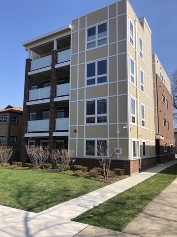 a view of a building with a yard