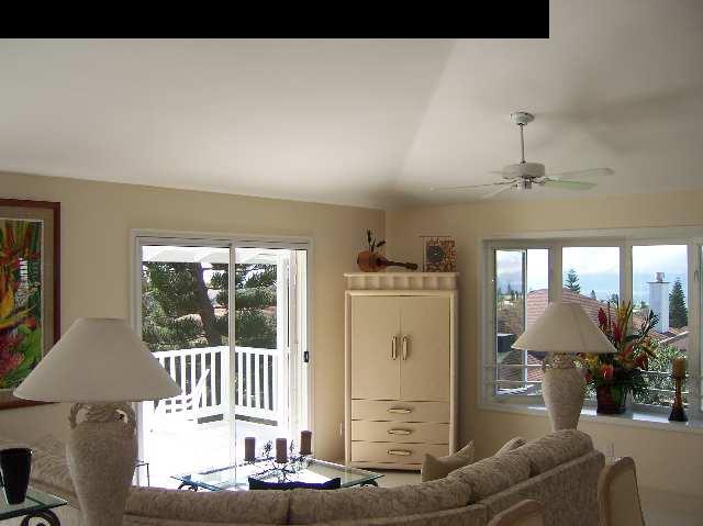 2811 Liholani Street, Unit 4 Pukalani, HI 96768 - Photo 13 of 22 a living room with furniture a window and a chandelier