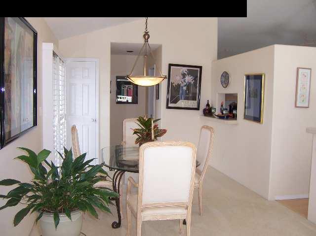 2811 Liholani Street, Unit 4 Pukalani, HI 96768 - Photo 9 of 22 a dining room with furniture and a potted plant