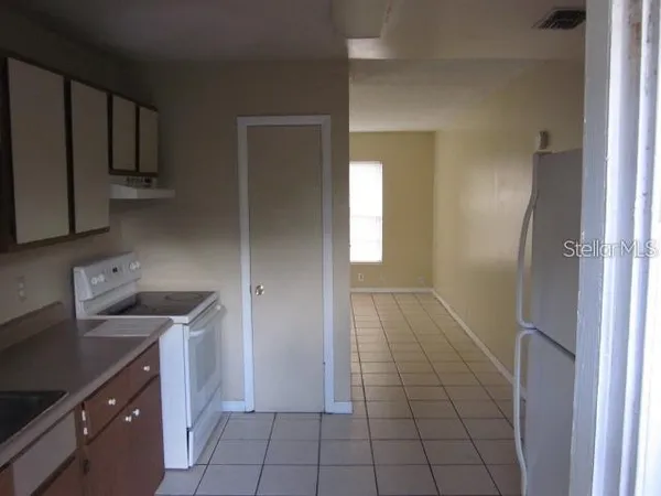 a bath room with a toilet and a bath tub