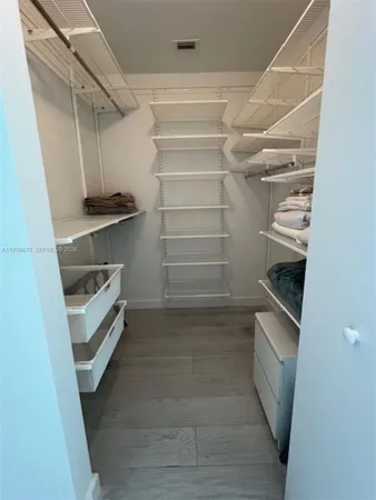 a view of an empty walk in closet
