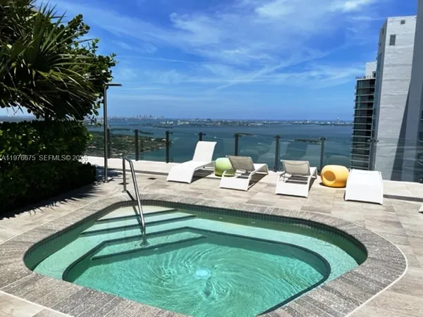 a view of swimming pool with a lounge chair
