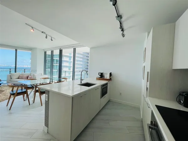 a kitchen with a stove and a table