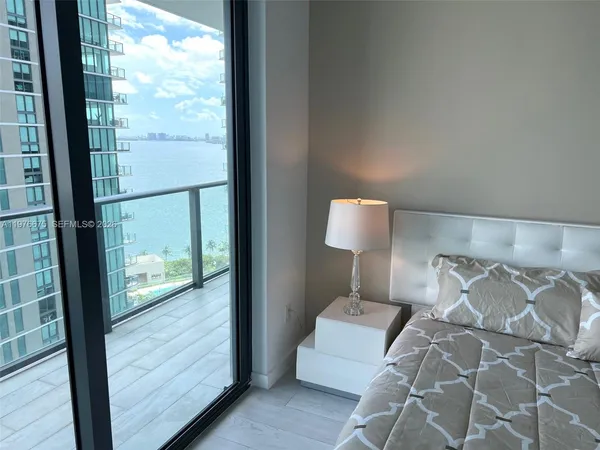a view of a balcony with wooden floor
