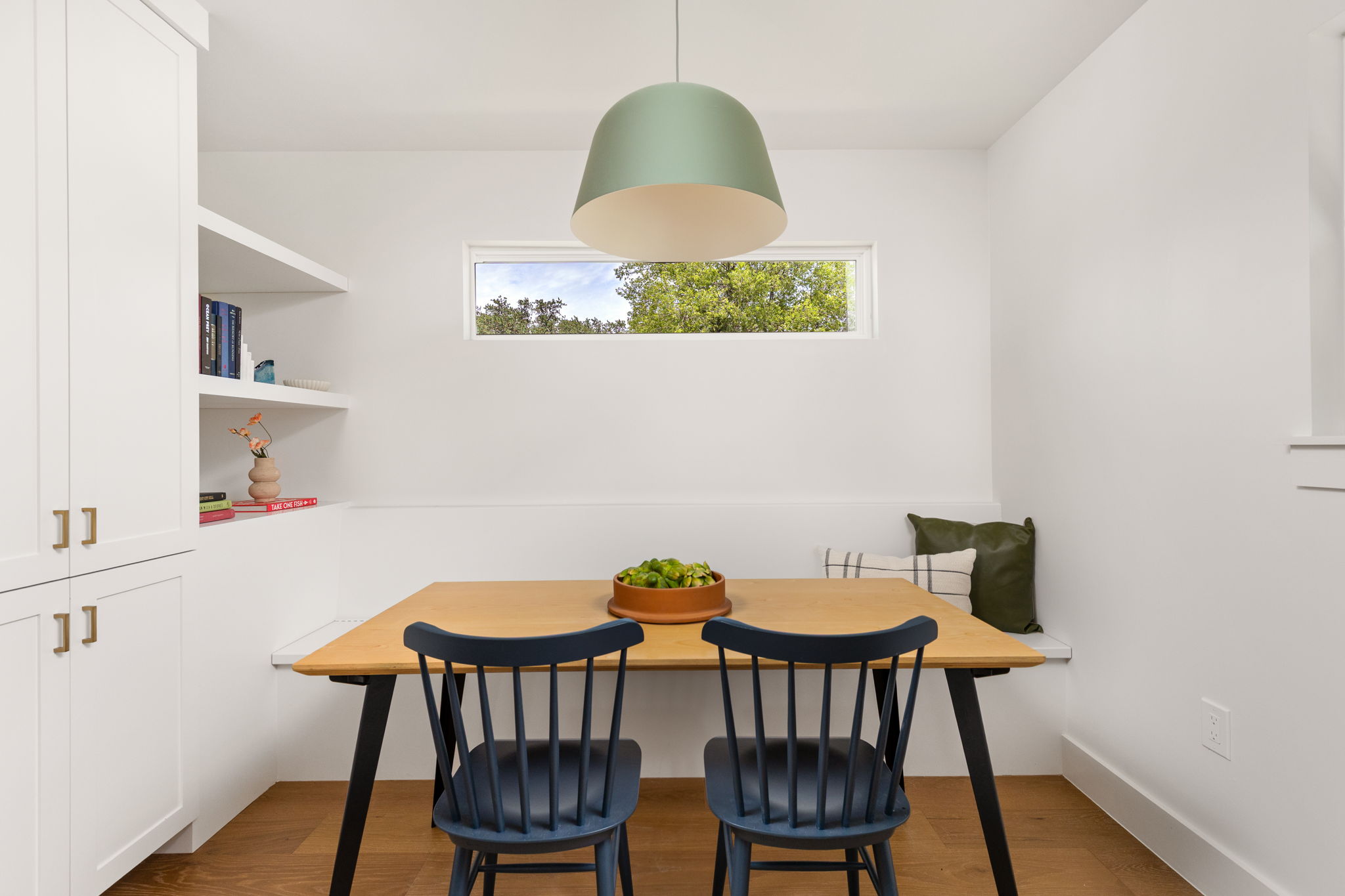 4501 Pack Saddle Pass Austin, TX 78745 - Photo 15 of 37 Built-in banquette seating with a contemporary pendant light fixture