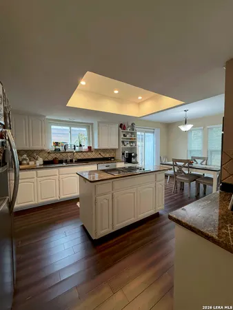 a kitchen with counter top space cabinets and appliances