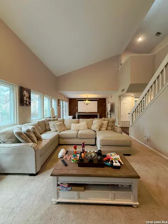 a living room with furniture and a rug