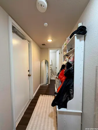 a view of a hallway with stairs