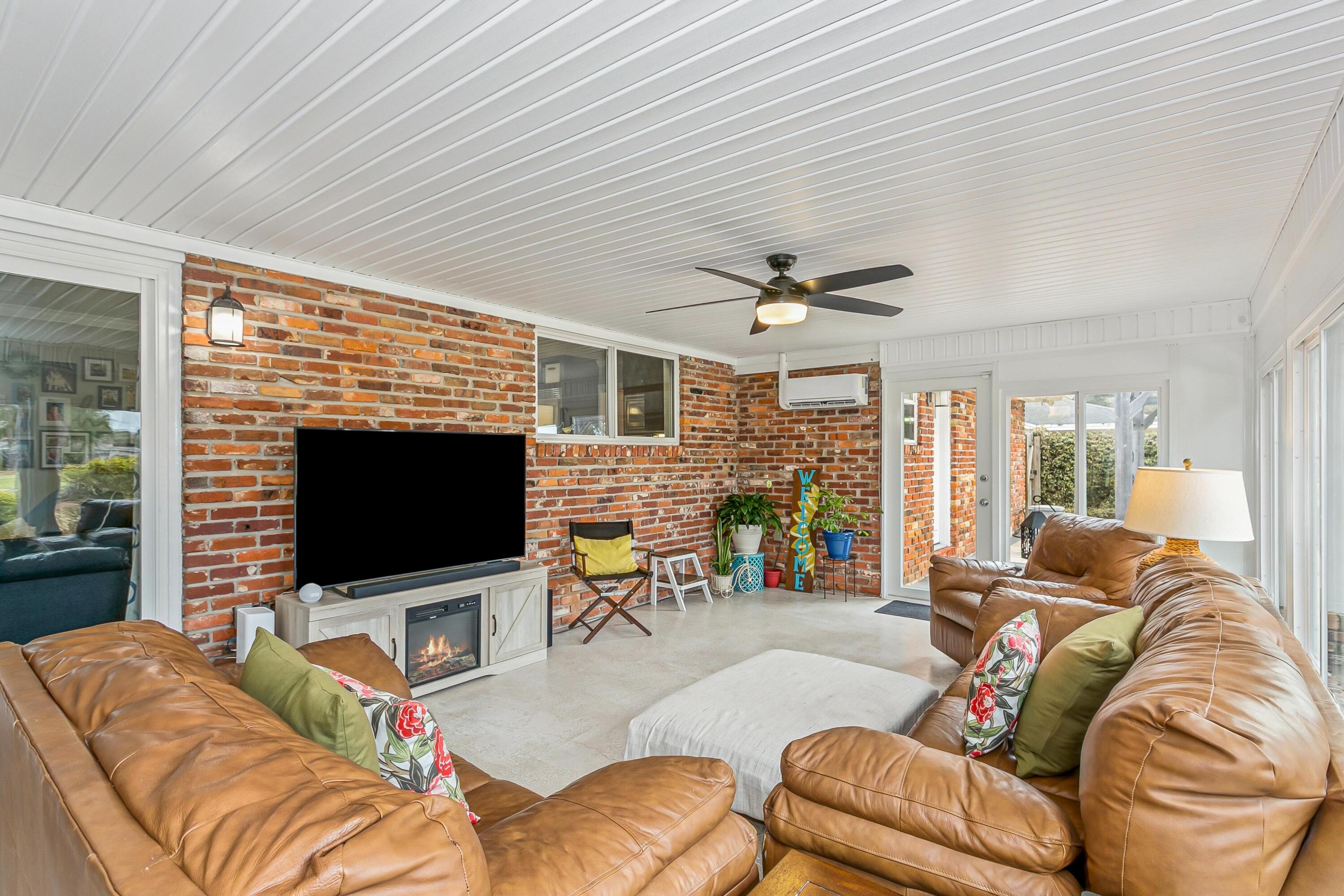 76 Country Club Road Shalimar, FL 32579 - Photo 12 of 47 a living room with furniture and a flat screen tv