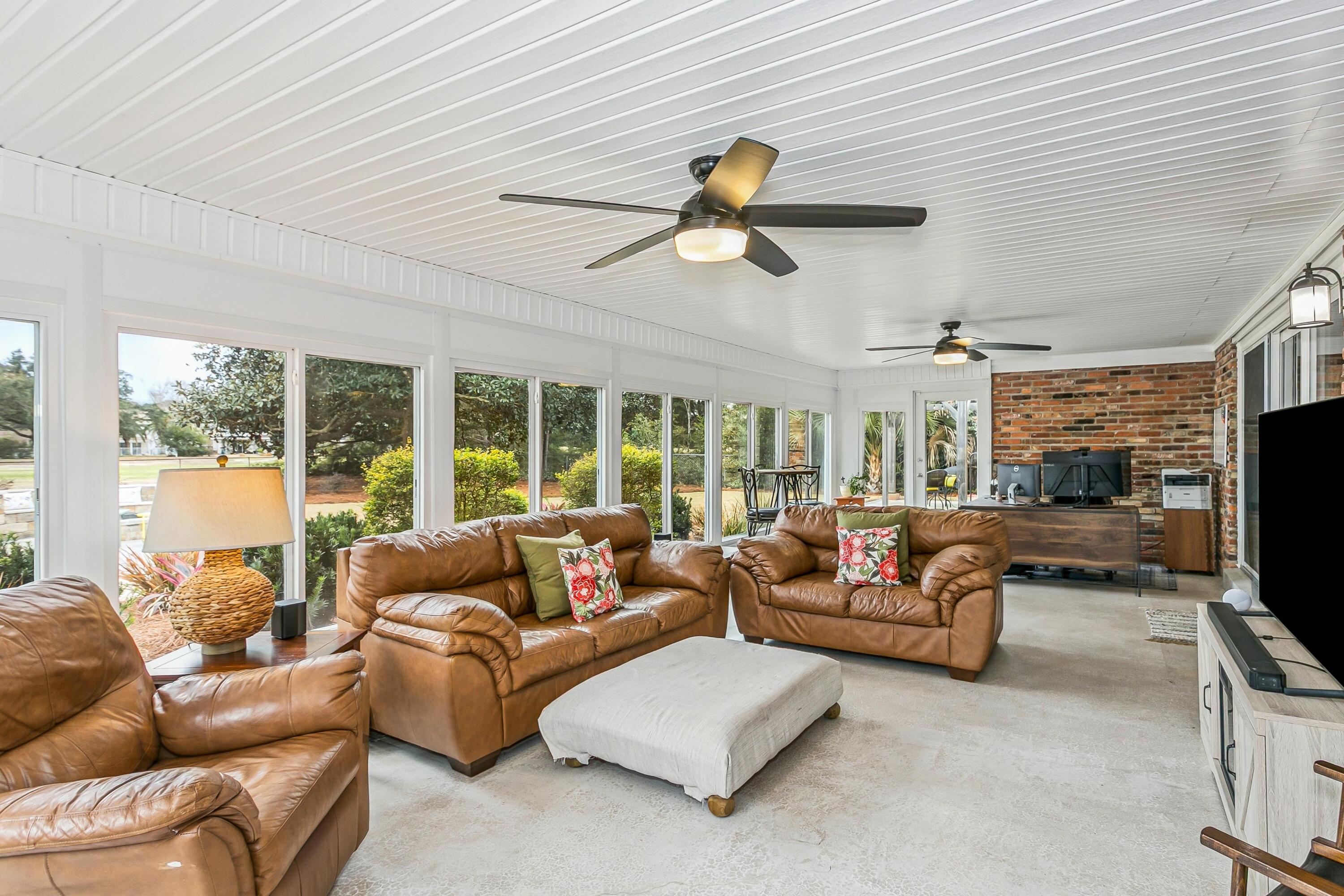 76 Country Club Road Shalimar, FL 32579 - Photo 13 of 47 a living room with furniture and a flat screen tv