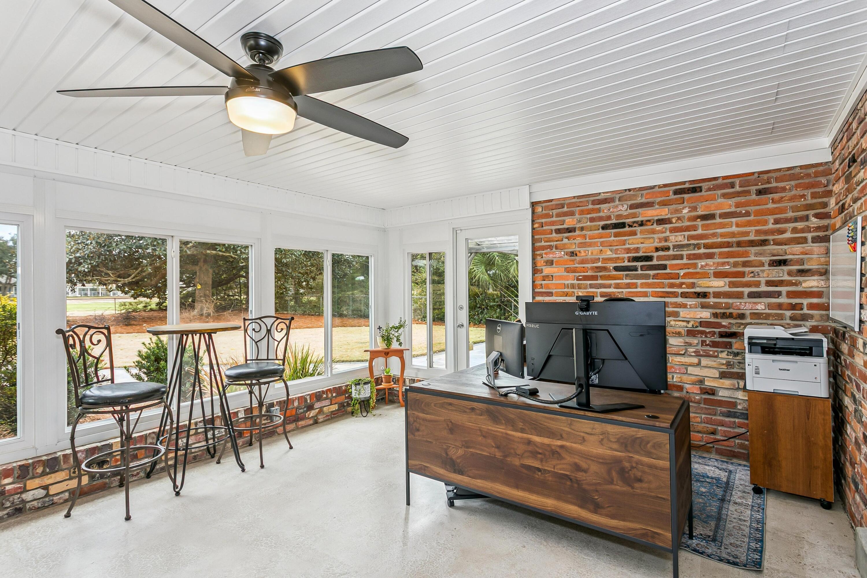 76 Country Club Road Shalimar, FL 32579 - Photo 14 of 47 a living room with furniture and a floor to ceiling window