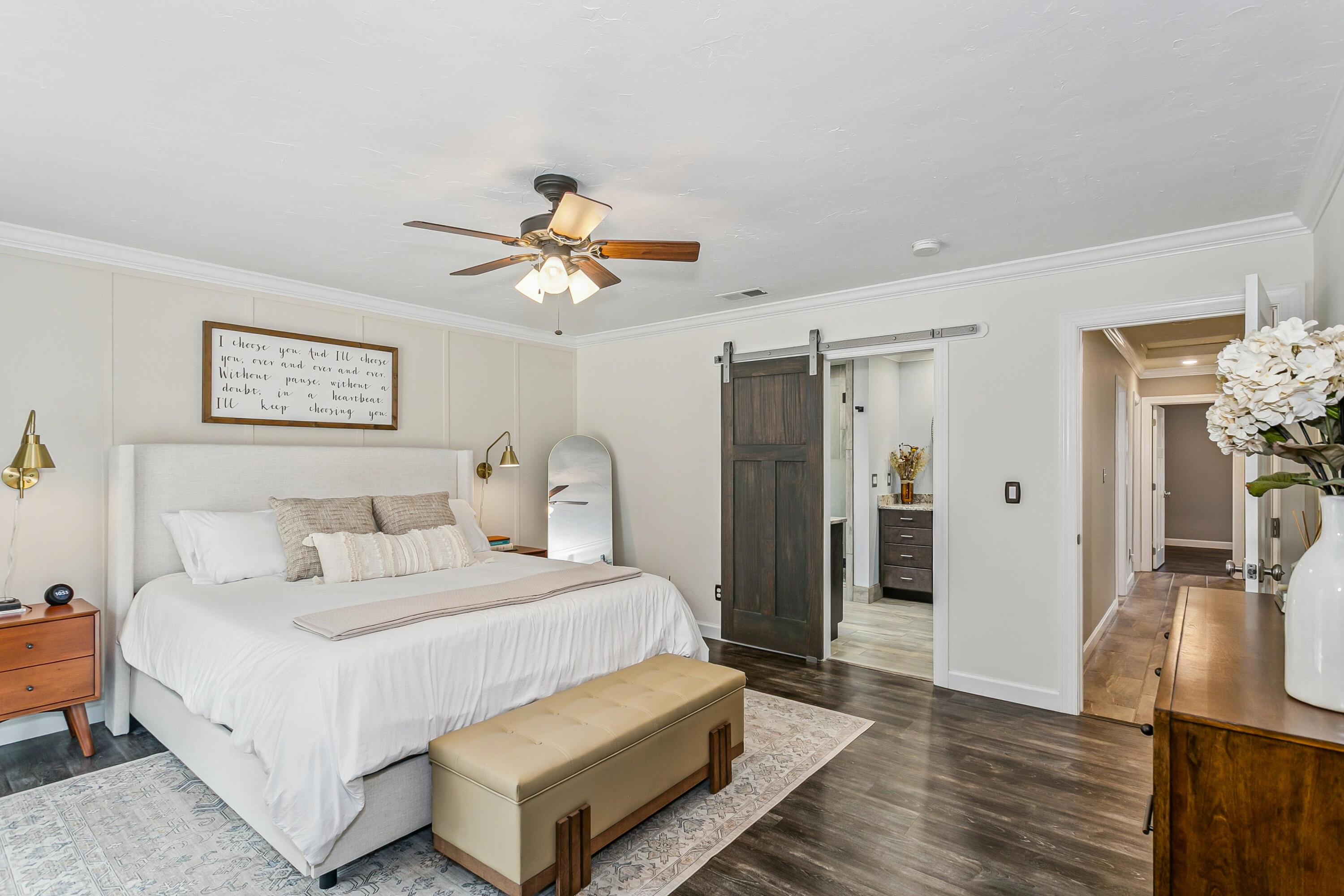 76 Country Club Road Shalimar, FL 32579 - Photo 17 of 47 a spacious bedroom with a bed and wooden floor