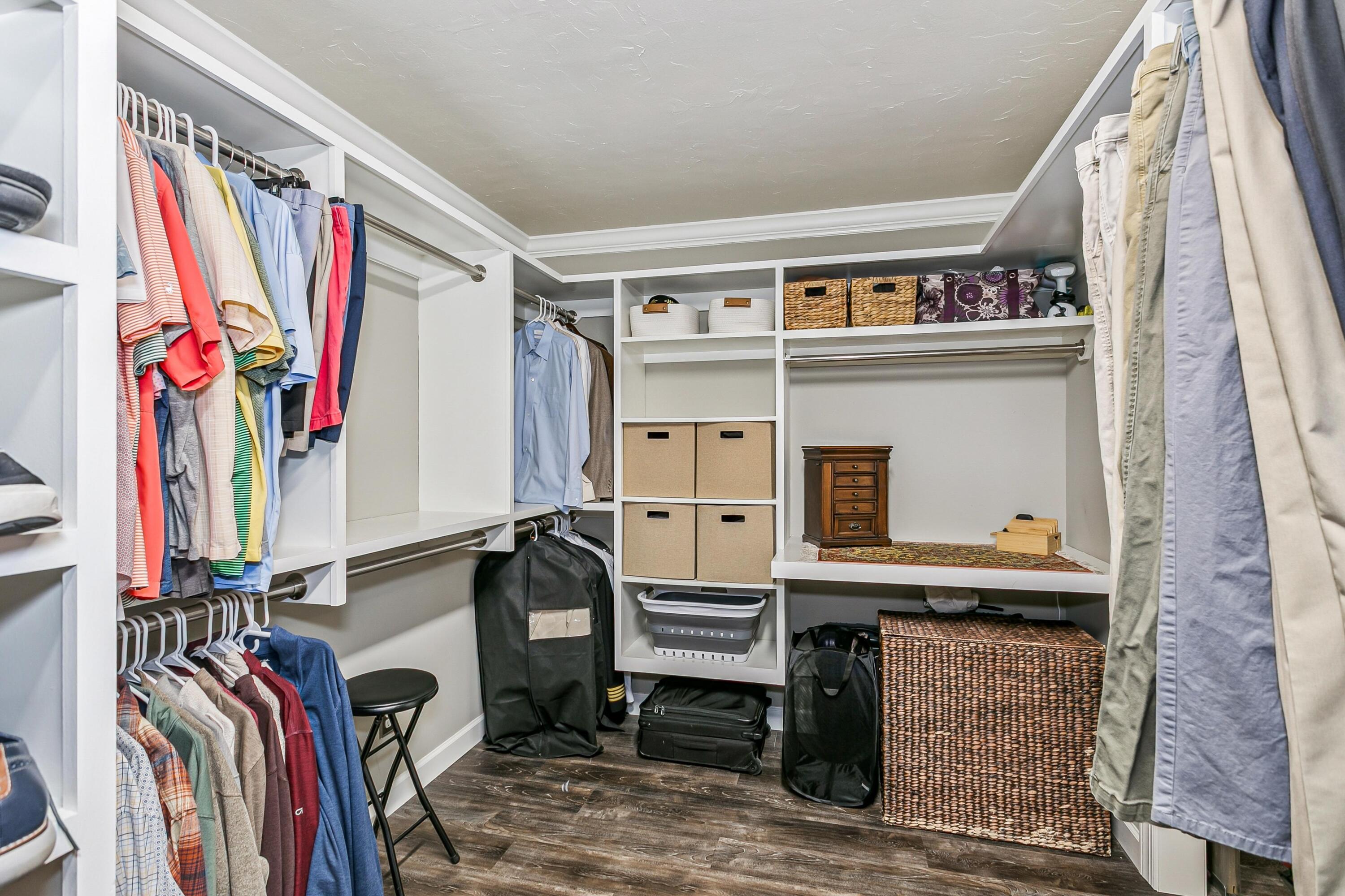 76 Country Club Road Shalimar, FL 32579 - Photo 21 of 47 a view of walk in closet with clothes and shoes