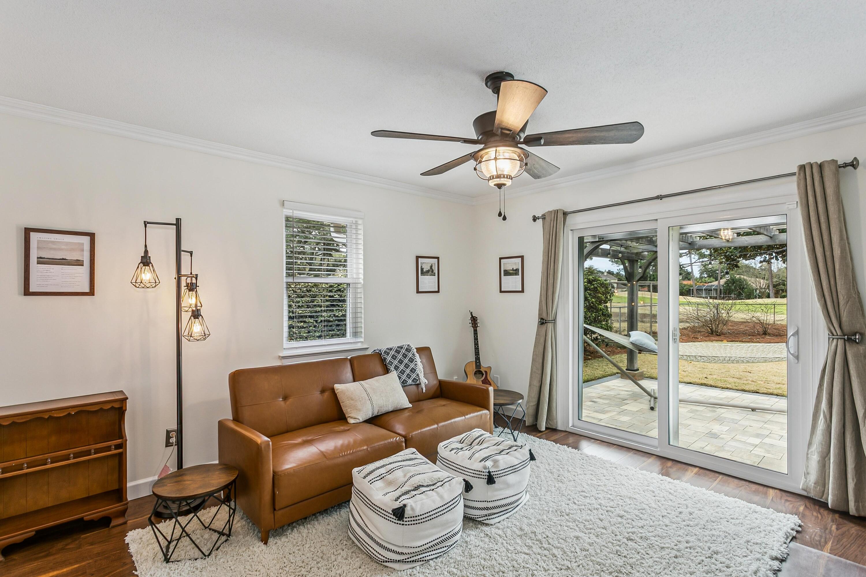 76 Country Club Road Shalimar, FL 32579 - Photo 28 of 47 a living room with furniture and a window