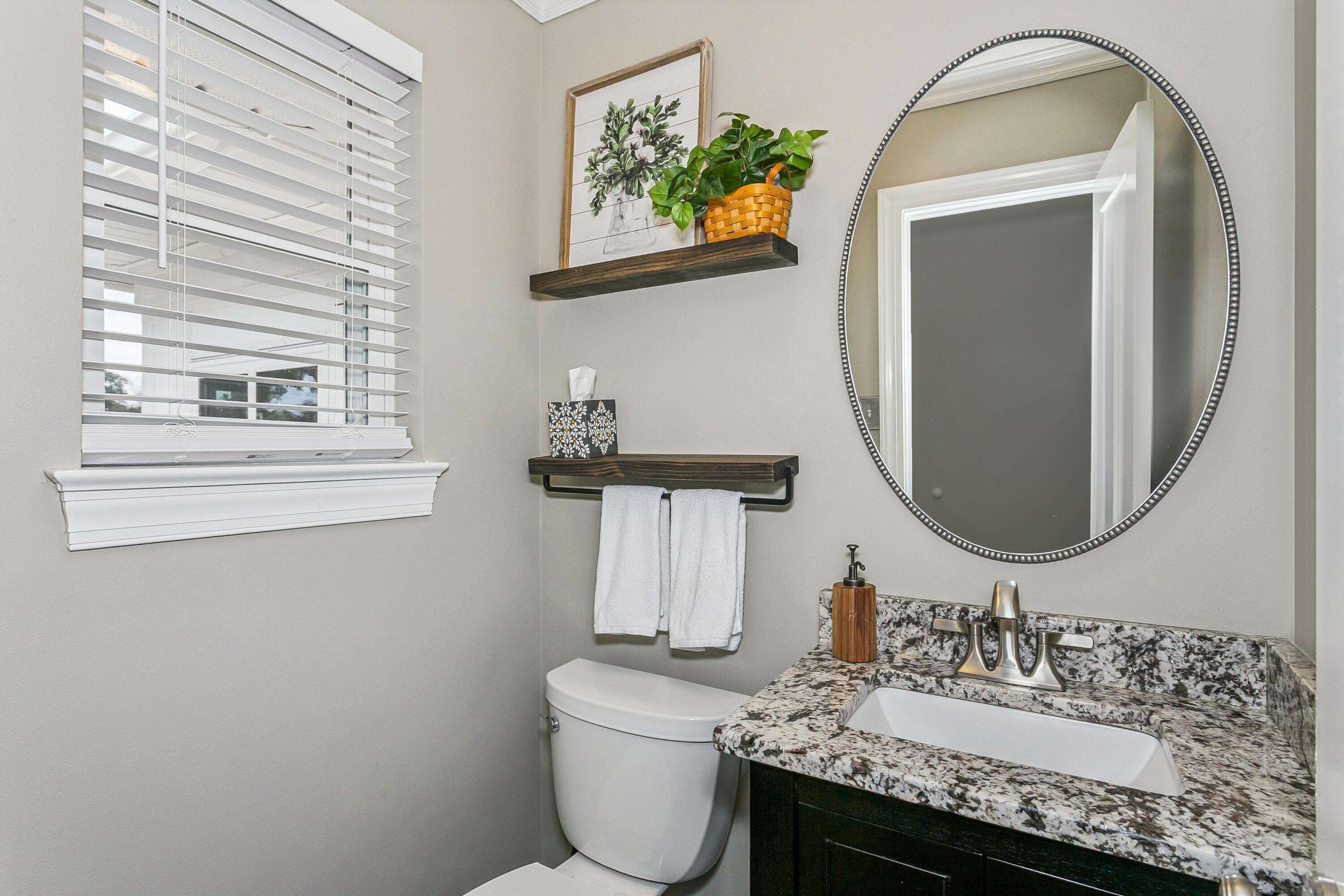 76 Country Club Road Shalimar, FL 32579 - Photo 30 of 47 a bathroom with a sink and a mirror