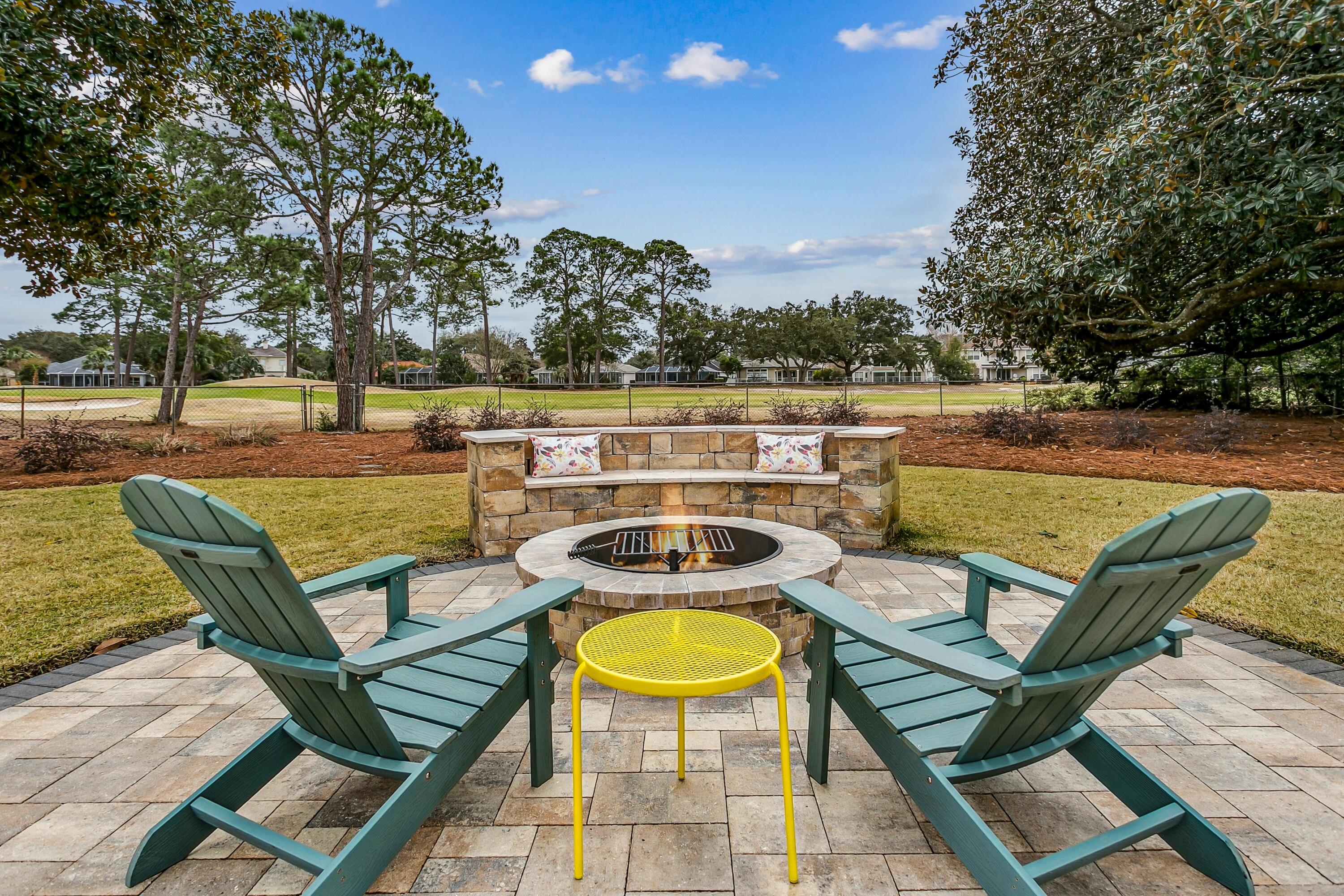 76 Country Club Road Shalimar, FL 32579 - Photo 35 of 47 a view of a swimming pool with lounge chairs