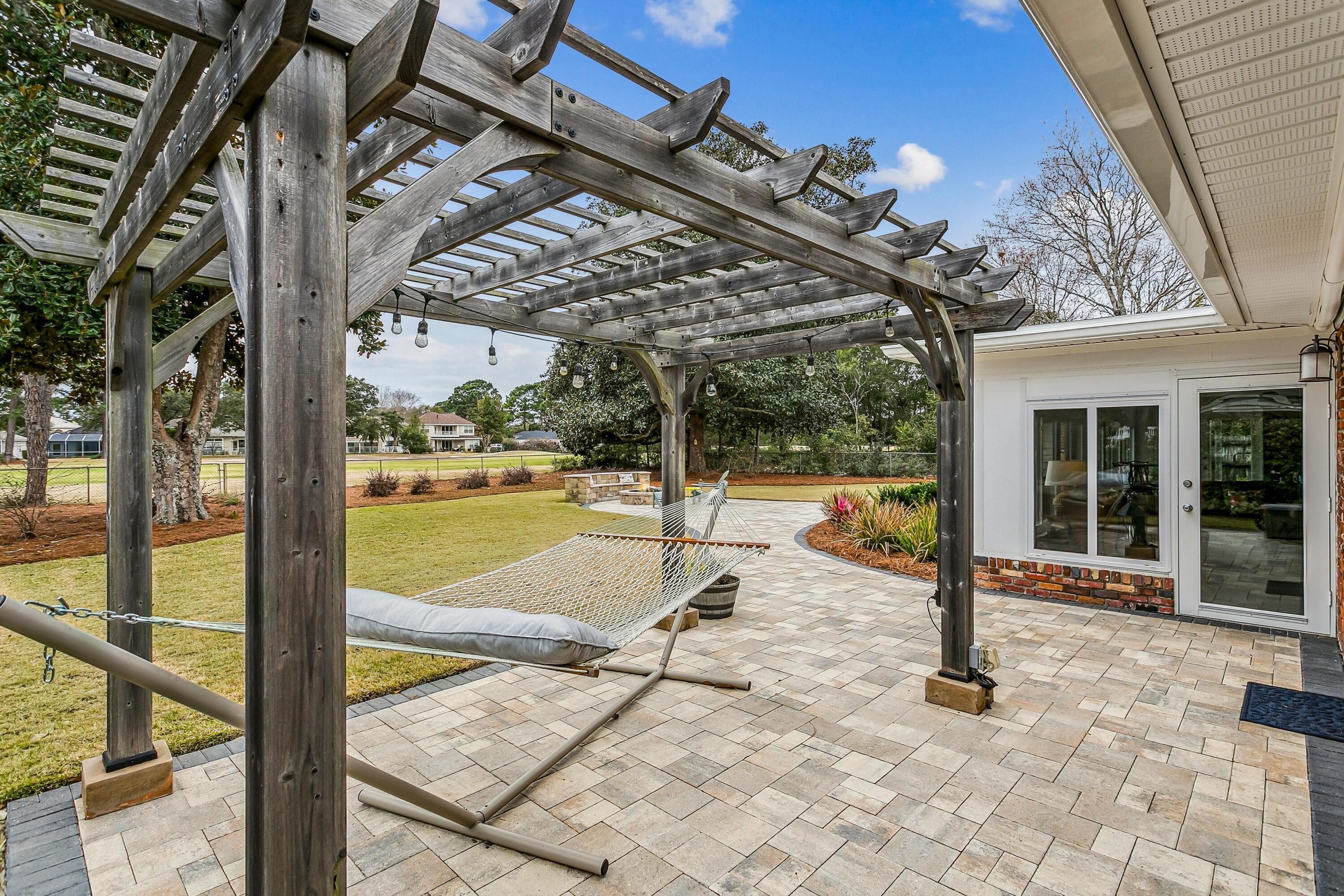 76 Country Club Road Shalimar, FL 32579 - Photo 37 of 47 a view of a swimming pool with a patio