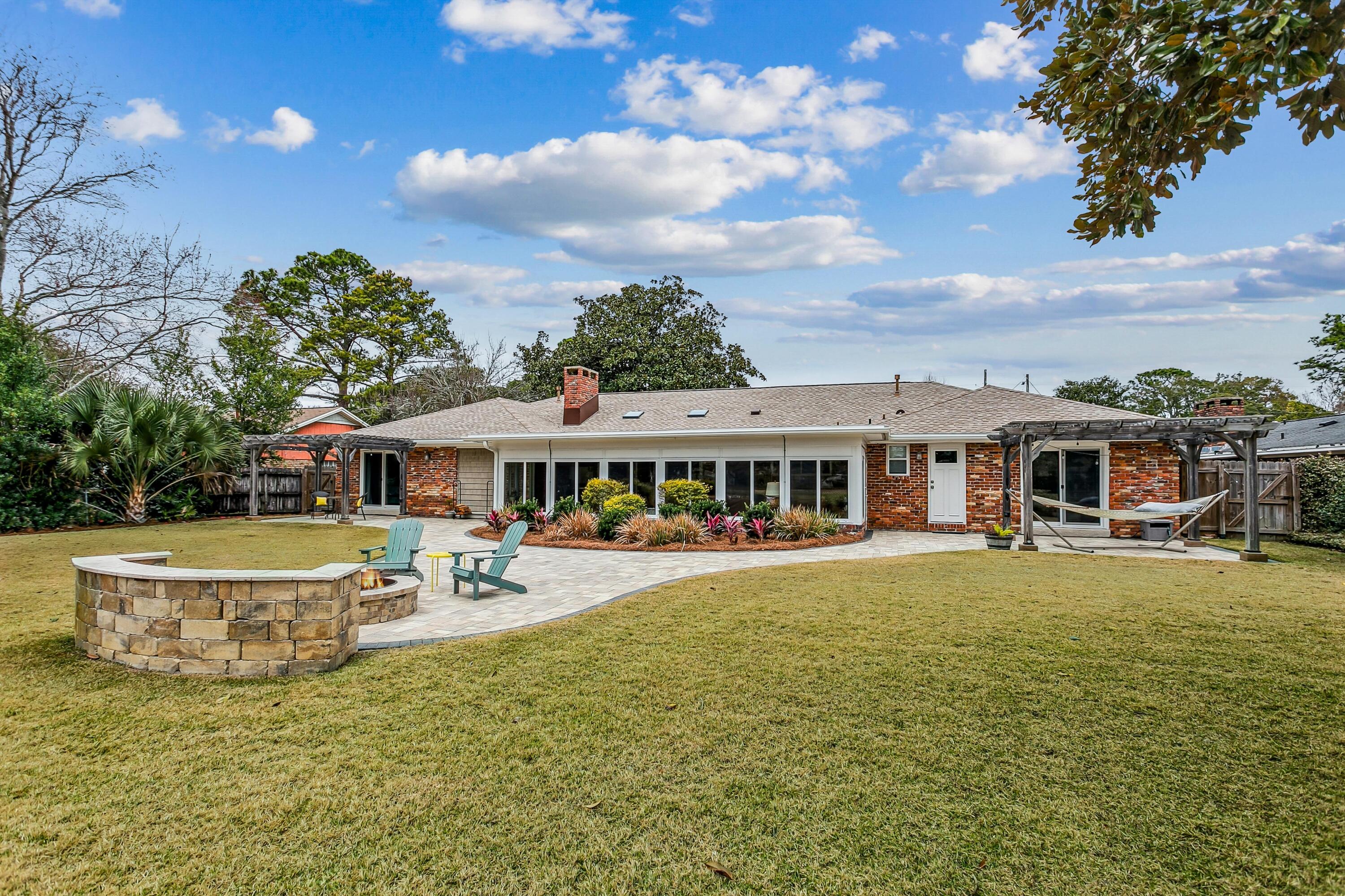 76 Country Club Road Shalimar, FL 32579 - Photo 39 of 47 a front view of a house with garden