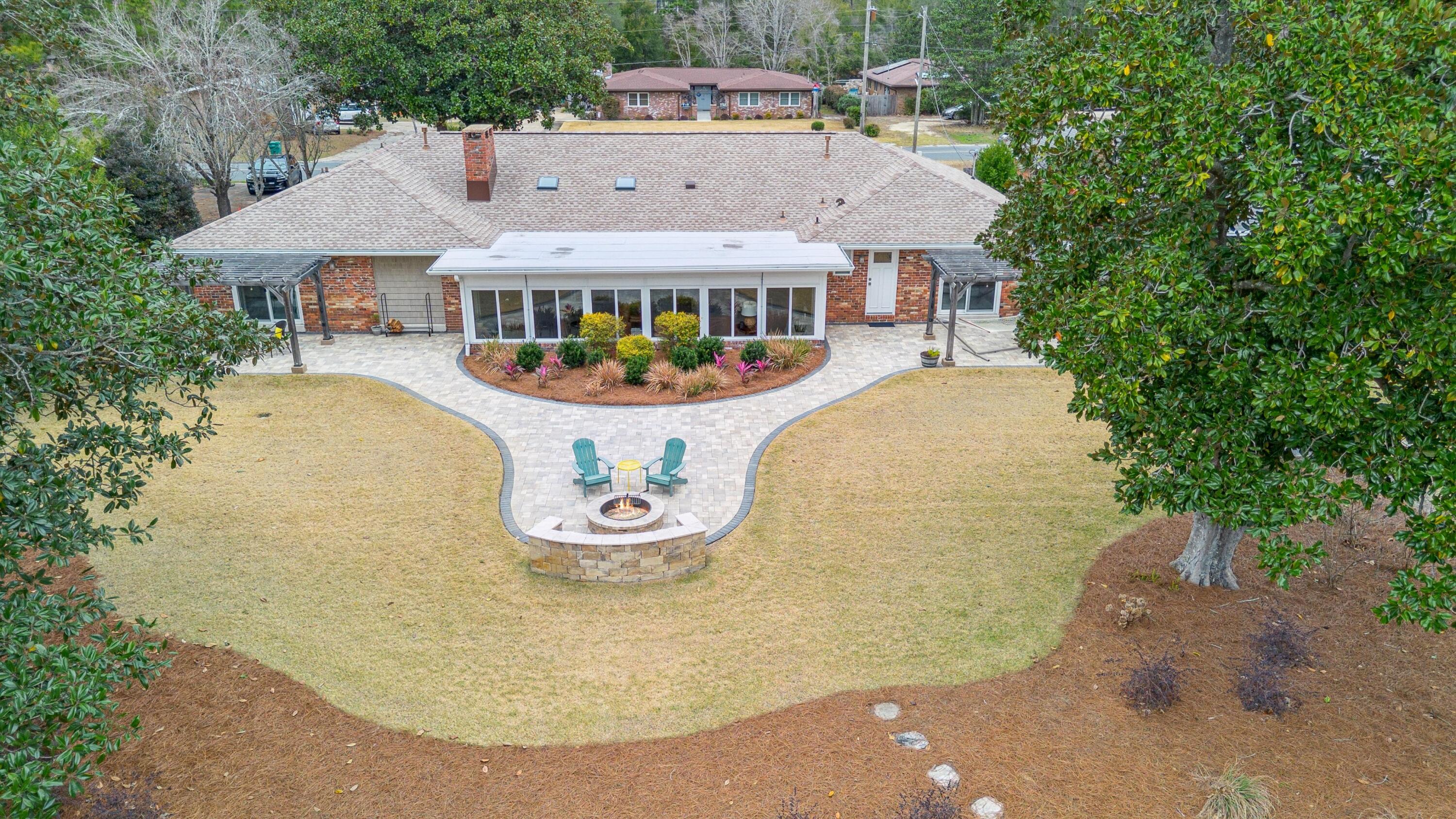 76 Country Club Road Shalimar, FL 32579 - Photo 45 of 47 a front view of house with yard and trees around