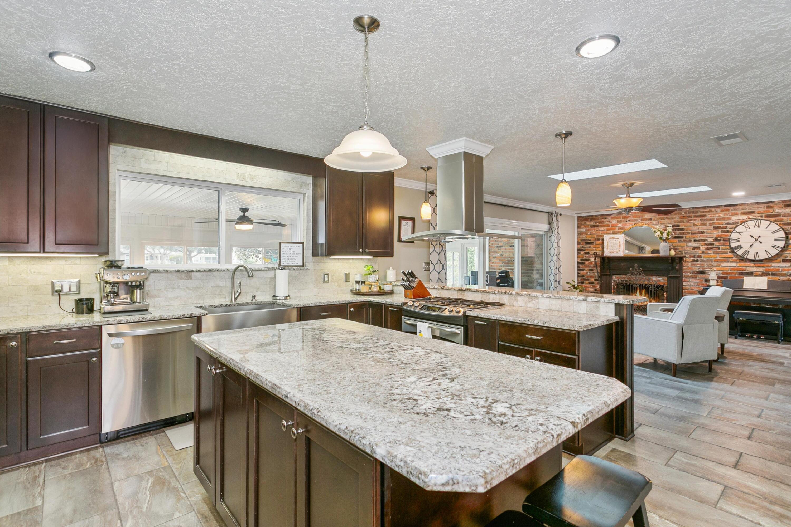 76 Country Club Road Shalimar, FL 32579 - Photo 7 of 47 a kitchen with a sink a counter top space and appliances