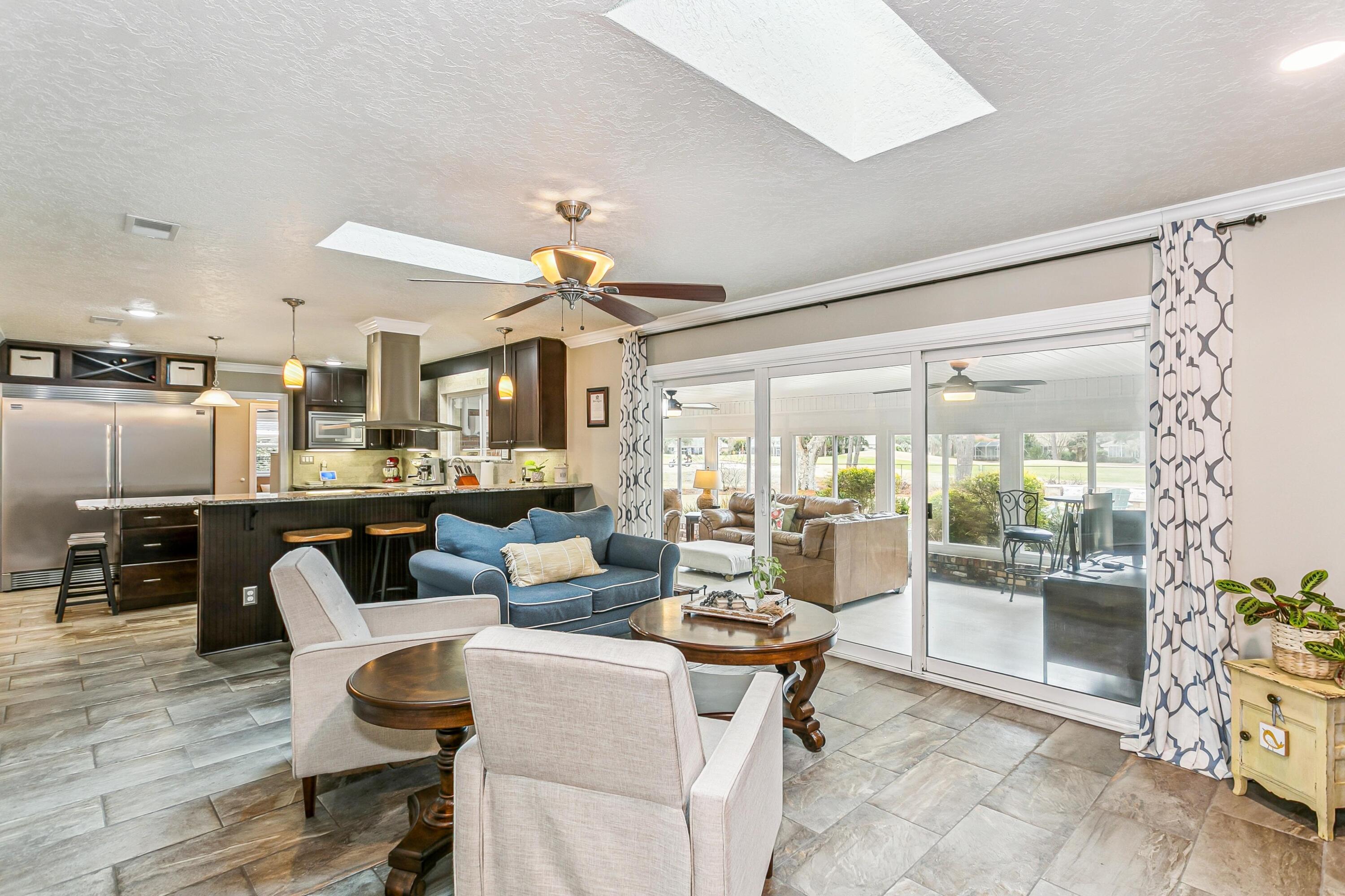76 Country Club Road Shalimar, FL 32579 - Photo 10 of 47 a living room with lots of furniture and painting on the wall