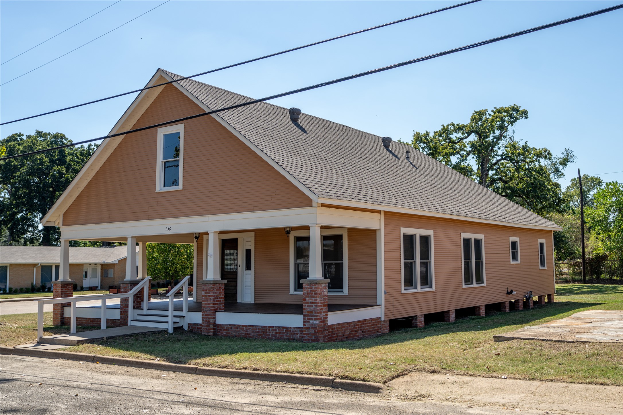 236 Main Street Grapeland, TX 75844 - Photo 2 of 31 a front view of a house with garden