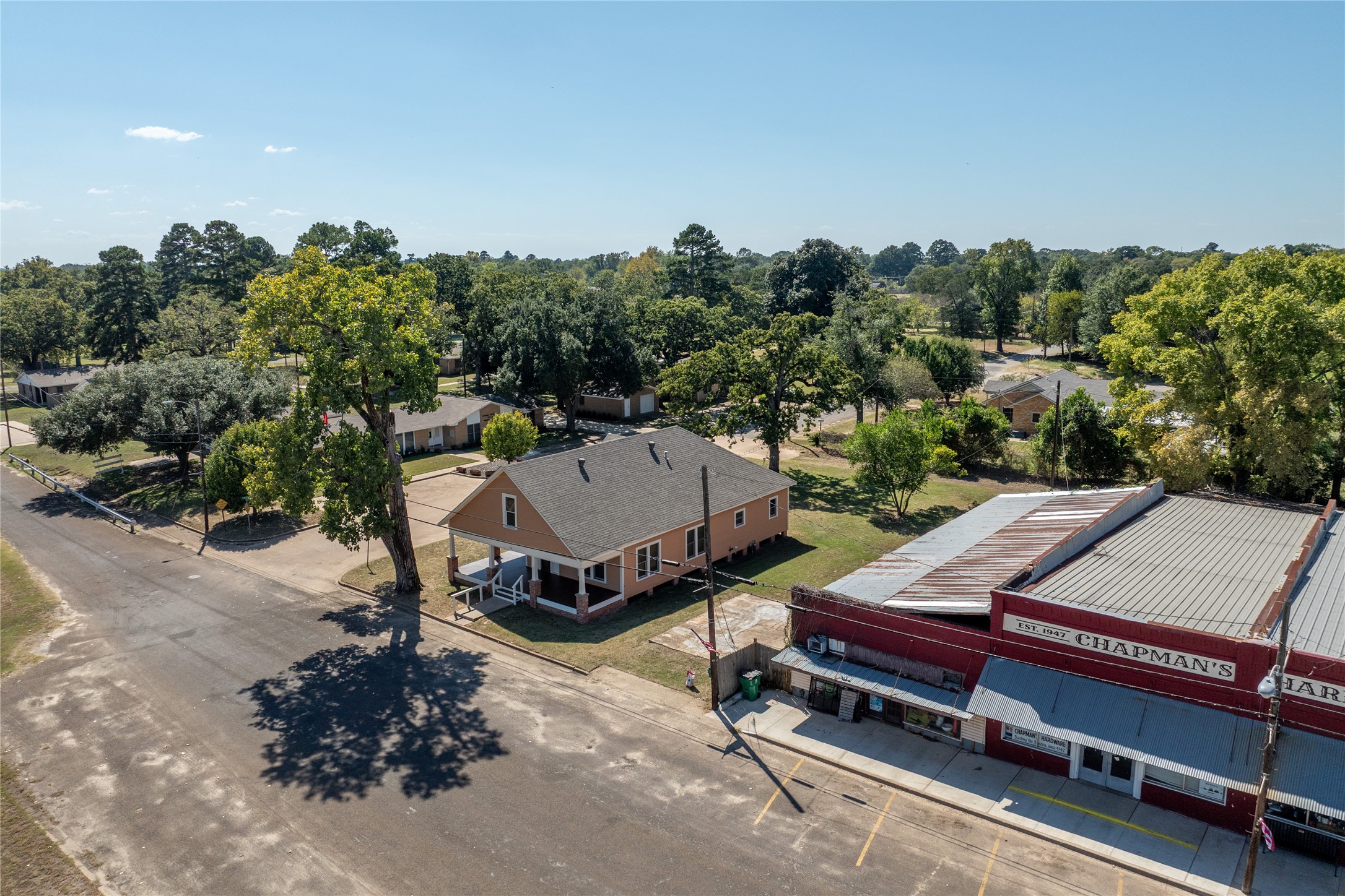 236 Main Street Grapeland, TX 75844 - Photo 23 of 31 a roof deck with a table and chairs with wooden fence