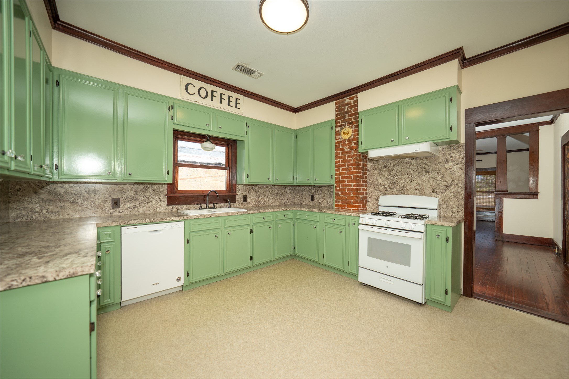 236 Main Street Grapeland, TX 75844 - Photo 7 of 31 a kitchen that has a sink and a stove top oven