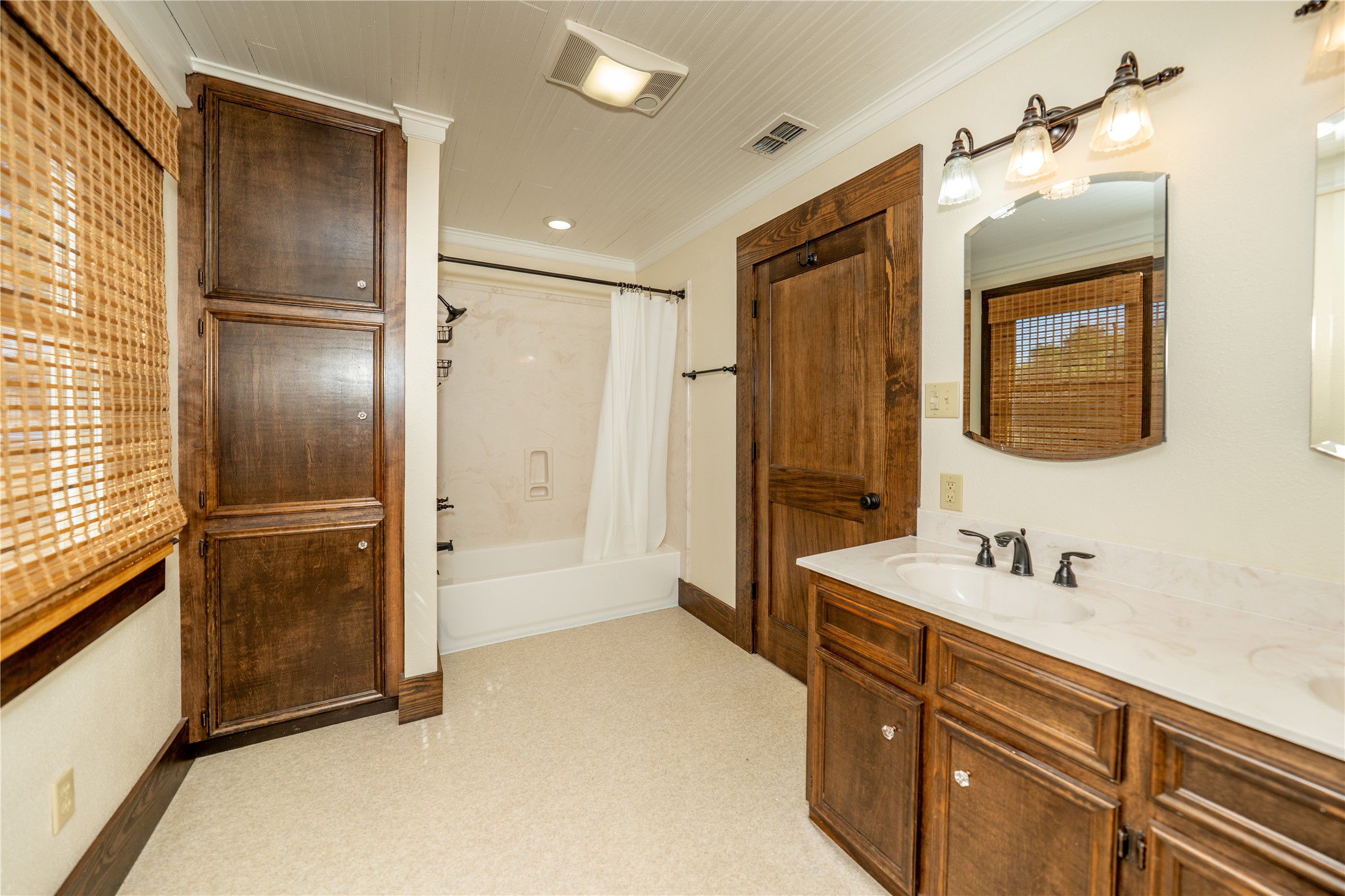 236 Main Street Grapeland, TX 75844 - Photo 9 of 31 a bathroom with a shower sink and mirror