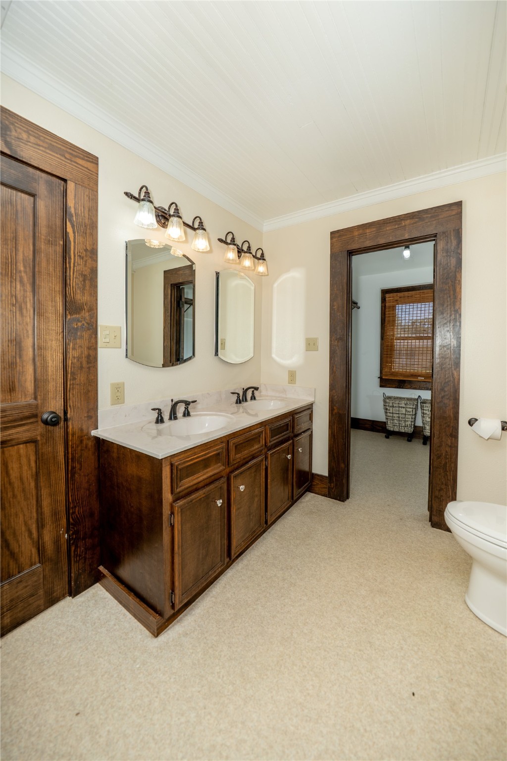 236 Main Street Grapeland, TX 75844 - Photo 10 of 31 a spacious bathroom with a double vanity sink and mirror