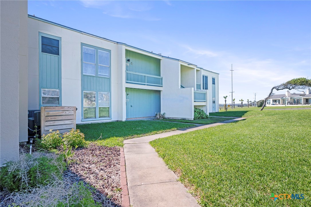 2003 North Fulton Beach Road, Unit 77 Rockport, TX 78382 - Photo 5 of 33 a house view with a garden space