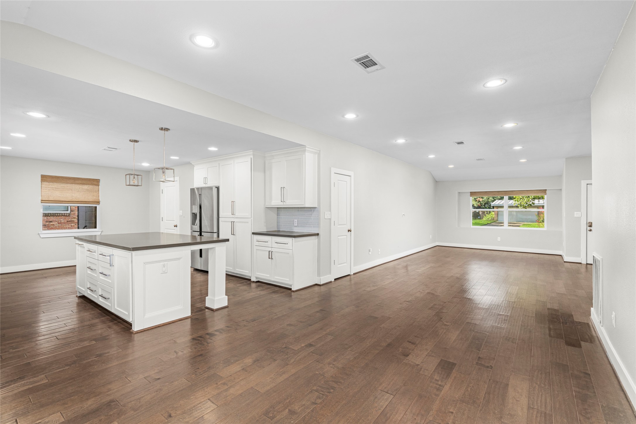 5723 Spellman Road Houston, TX 77096 - Photo 9 of 29 This wider view shows the kitchen’s connection to the dining and living areas, making the space comfortable for both everyday living and entertaining.