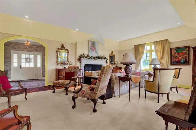 a view of a livingroom with furniture and a workspace
