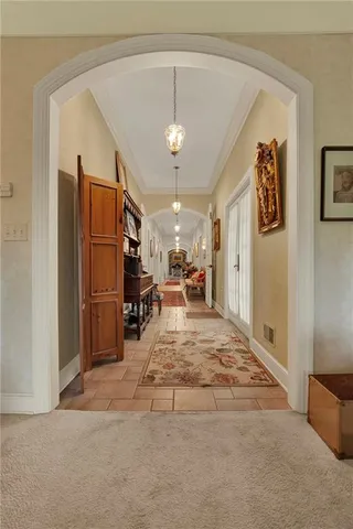 a view of a livingroom with furniture and a kitchen