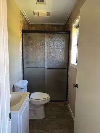 a view of a room with shelf on the wall