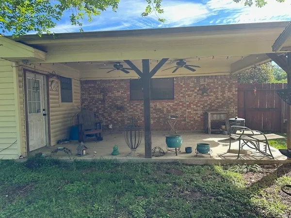 a view of a outdoor kitchen with a sink and a table