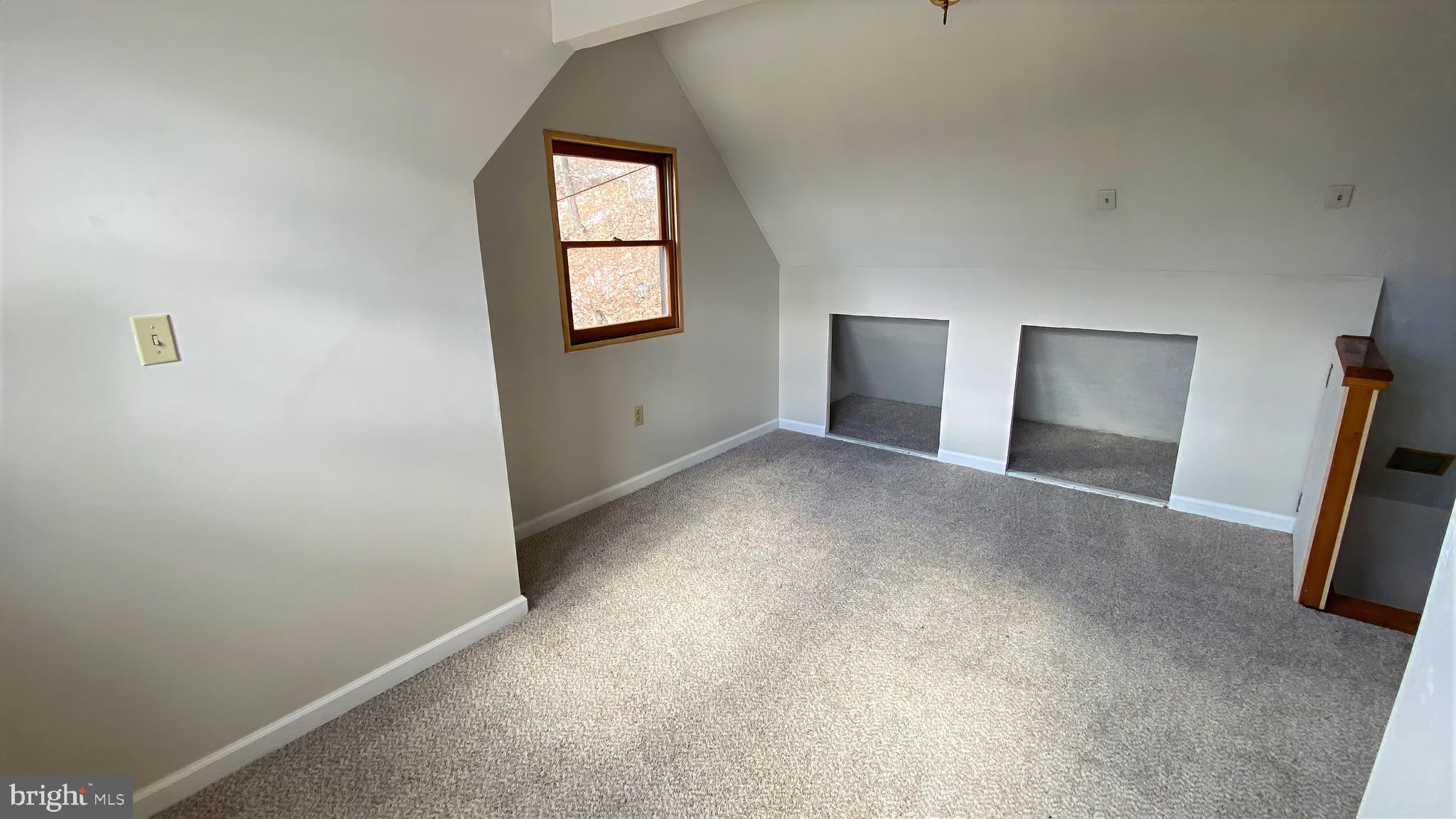 2932 Kerns School Road Springfield, WV 26763 - Photo 25 of 52 an empty room with windows and wooden floor