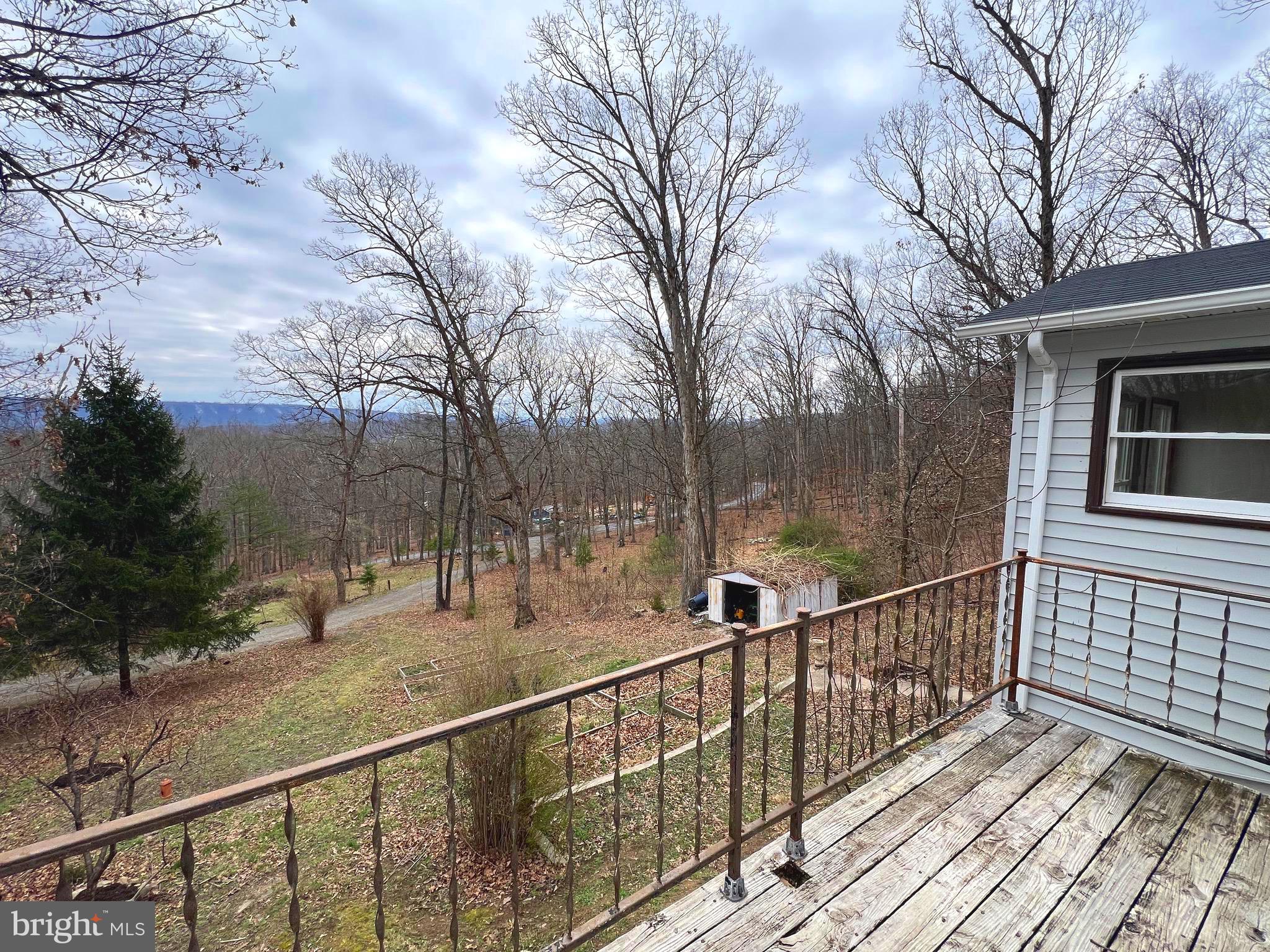 2932 Kerns School Road Springfield, WV 26763 - Photo 29 of 52 a view of a balcony with wooden fence and floor