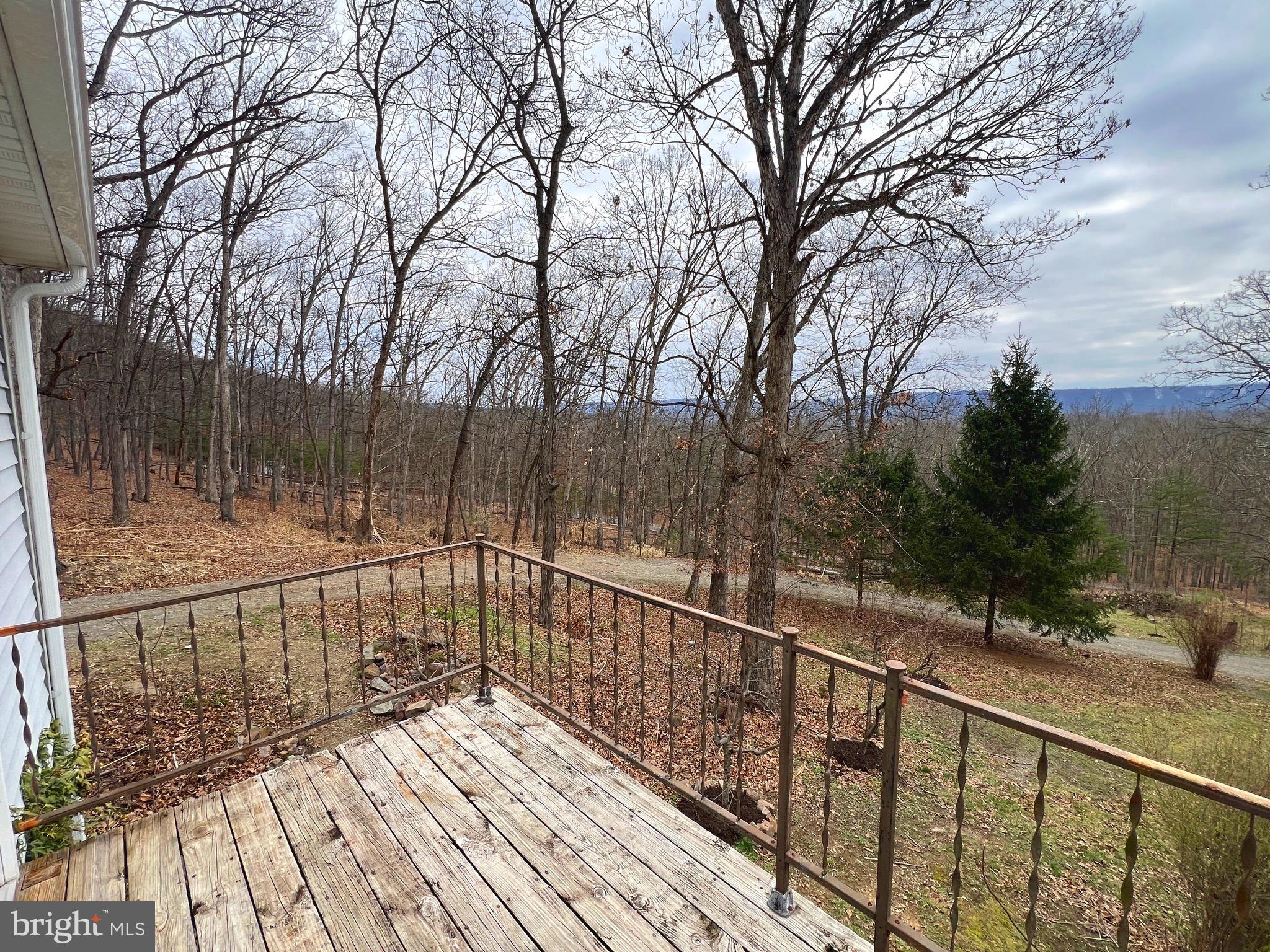 2932 Kerns School Road Springfield, WV 26763 - Photo 30 of 52 a view of balcony with wooden floor and fence