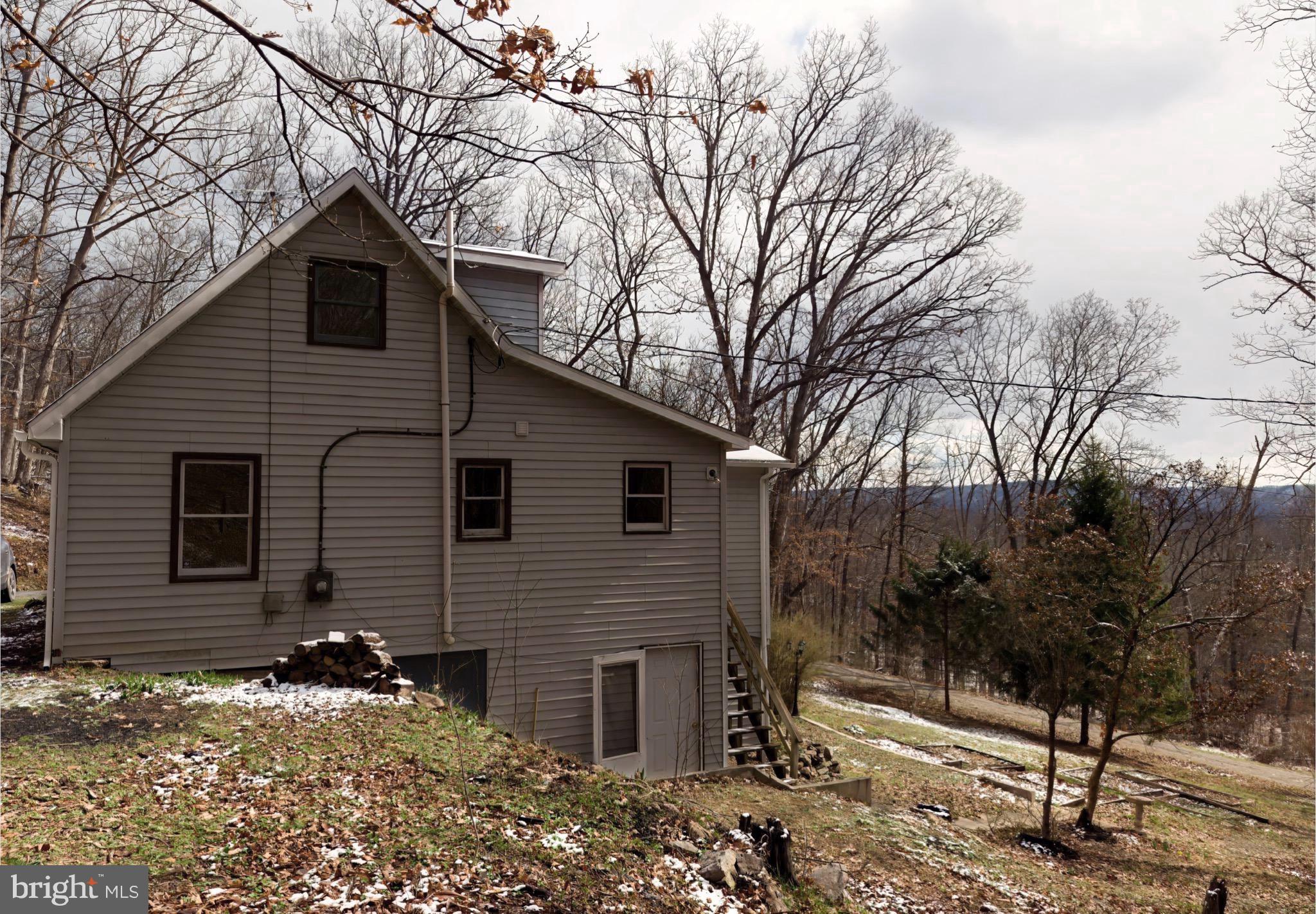 2932 Kerns School Road Springfield, WV 26763 - Photo 44 of 52 a front view of a house with a yard