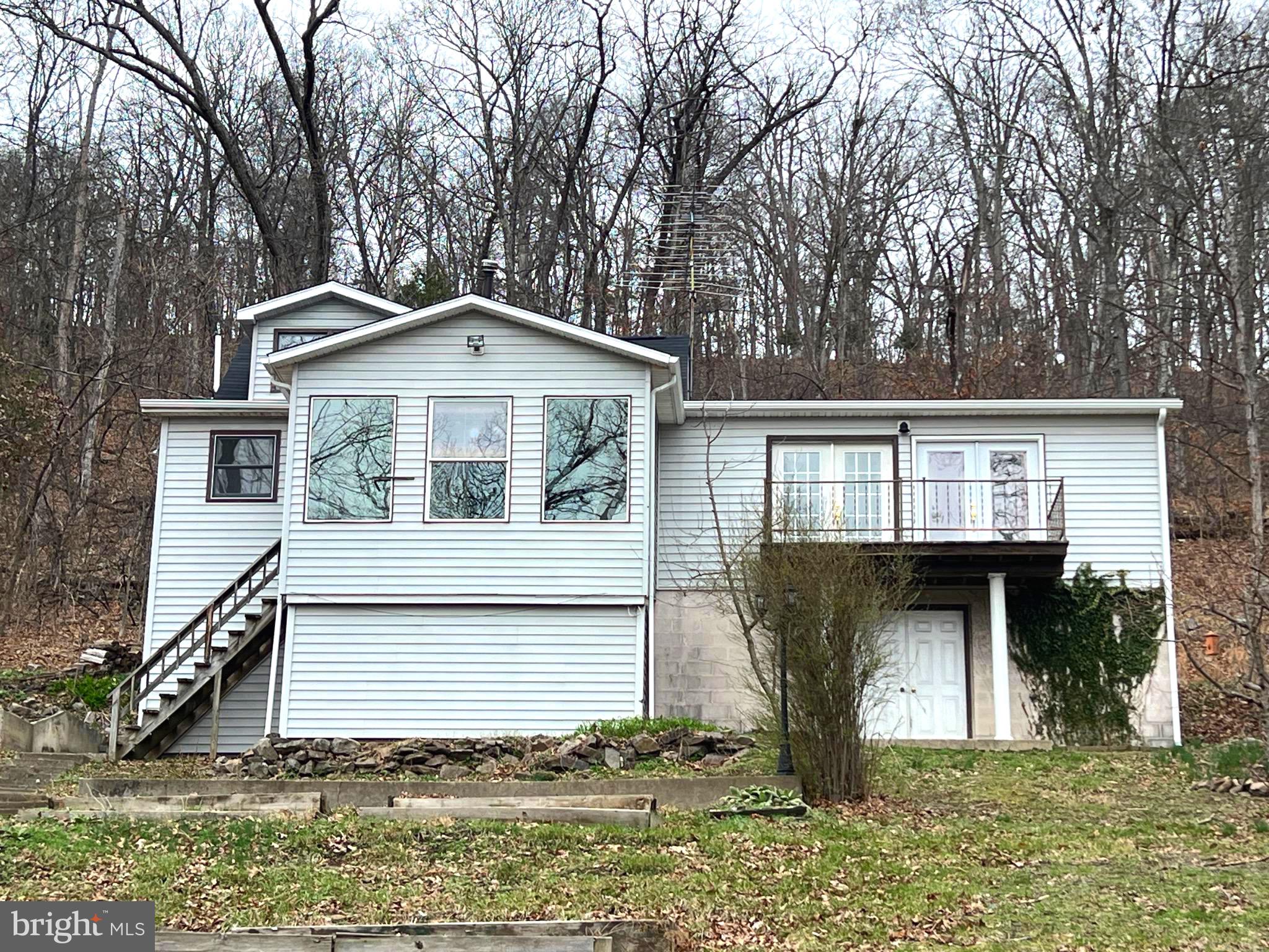2932 Kerns School Road Springfield, WV 26763 - Photo 5 of 52 a front view of a house with garden