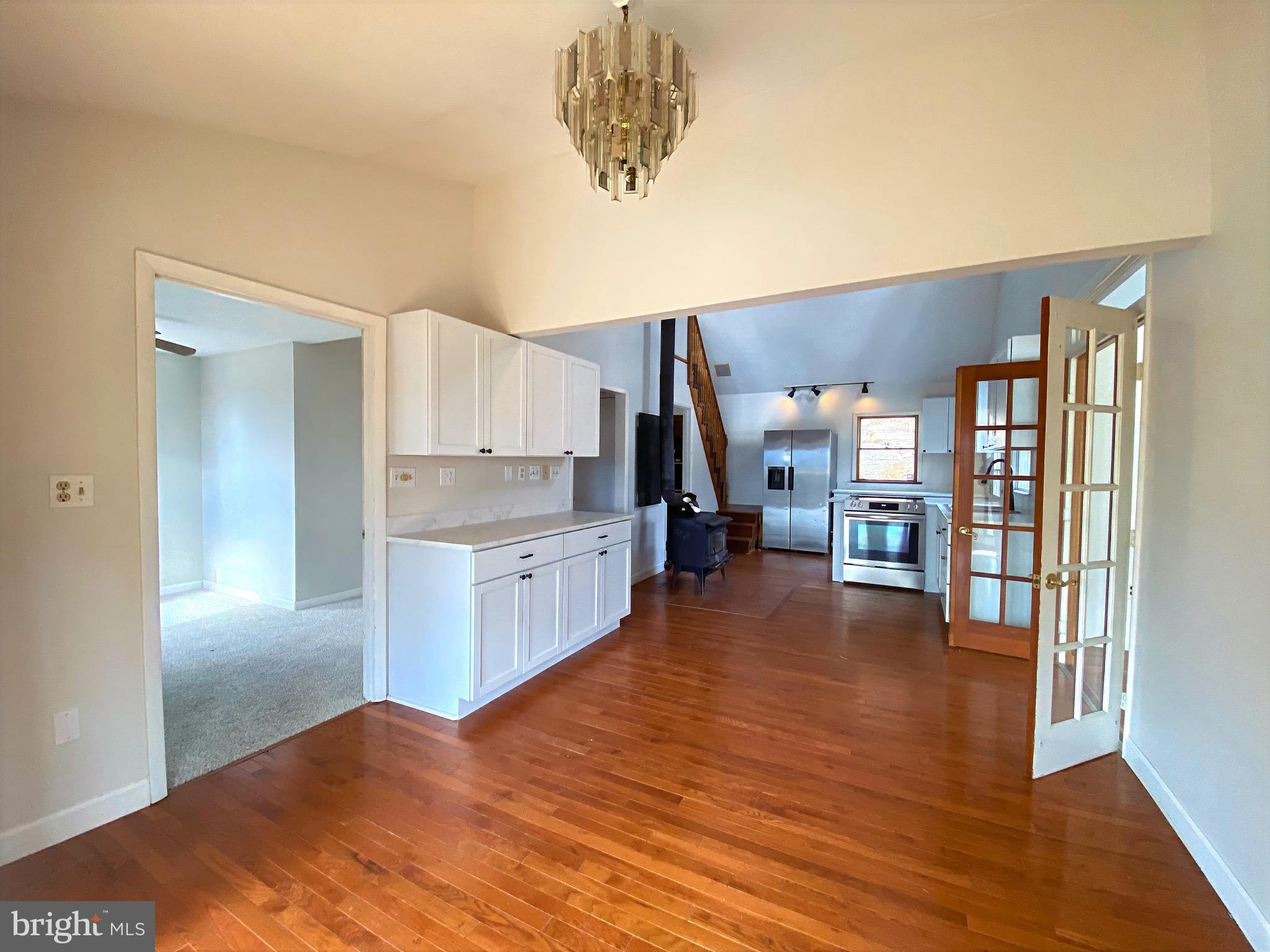 2932 Kerns School Road Springfield, WV 26763 - Photo 8 of 52 a open kitchen with cabinets and wooden floor